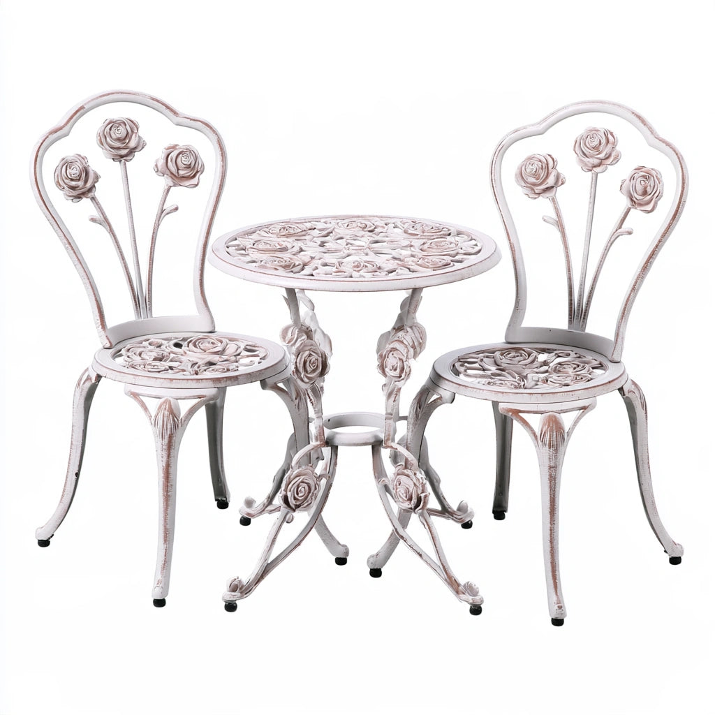 Vyrnloft white cast aluminum garden bistro set with table and chairs, outdoor furniture for patio or garden area.